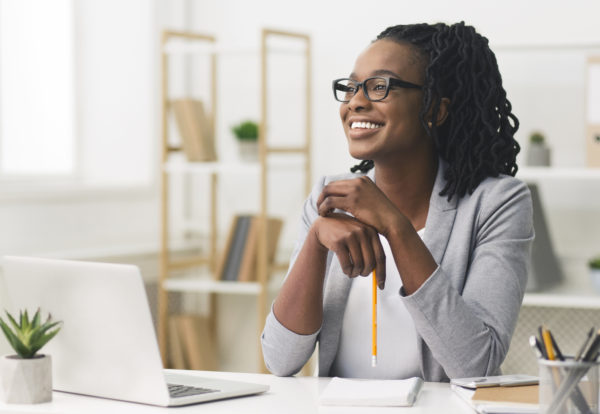 Business Career Concept. Afro Businesswoman Smiling Sitting In Modern Office. Copy Space