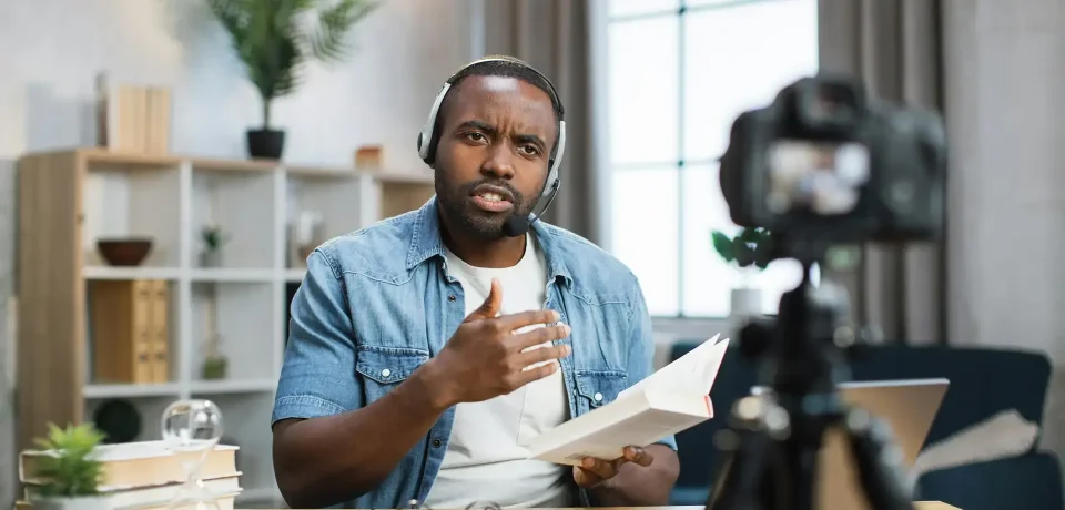 african man doing live stream at home
